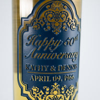 Close up of 50th anniversary message deep etched on a custom chardonnay wine bottle from Mano's Wine