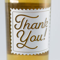 Close up of Thank You Stamp Chardonnay Custom Etched Wine bottle from Mano's Wine