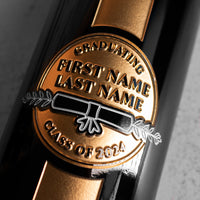 Graduating class, graduate name, and diploma etched on the Mano's Wine Graduation Award Etched Wine bottle