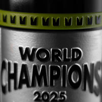 Mano's Wine silver and light green bottle etched with World Champions 2025