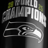 Close up of Seattle Seahawks team logo and 2025 World Champions etched on 3L wine bottle