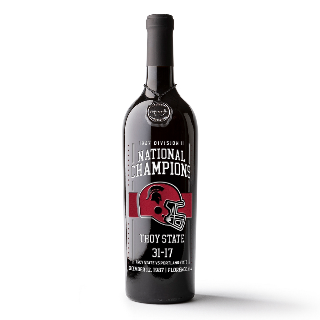 Etched wine bottle celebrating Troy University 1987 Football Champions with black and red design featuring the team's helmet and a score of 31-17.