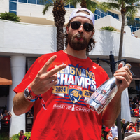 Florida Panthers hockey player celebrating Florida Panthers' Stanley Cup championship with Mano's Wine Florida Panthers bubbly wine