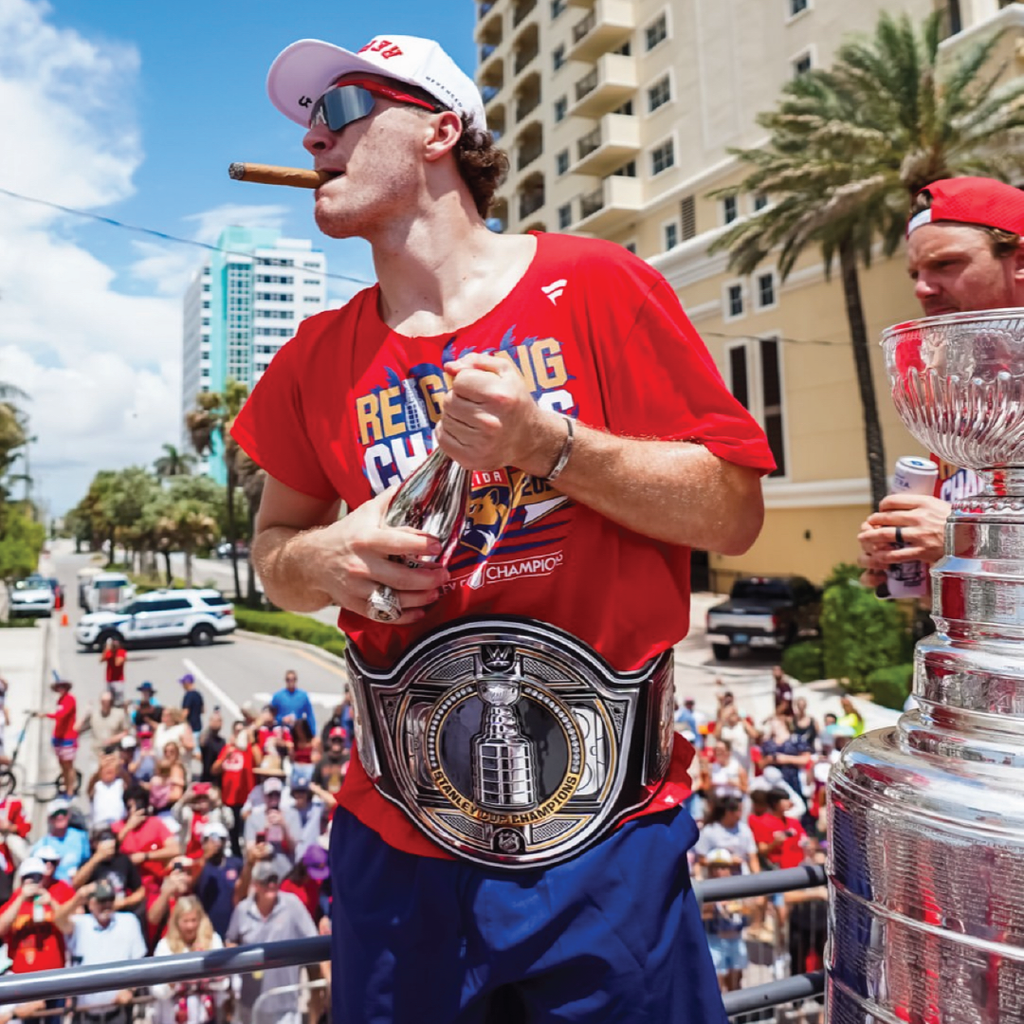 Panthers hockey player celebrates winning Stanley Cup championship with 2025 Florida Panthers Stanley Cup Champions Trophy Silver Bubbly bottle