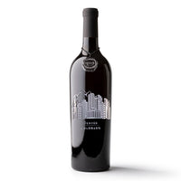 Mano's Wine bottle featuring the Denver, CO city skyline and Rocky Mountains