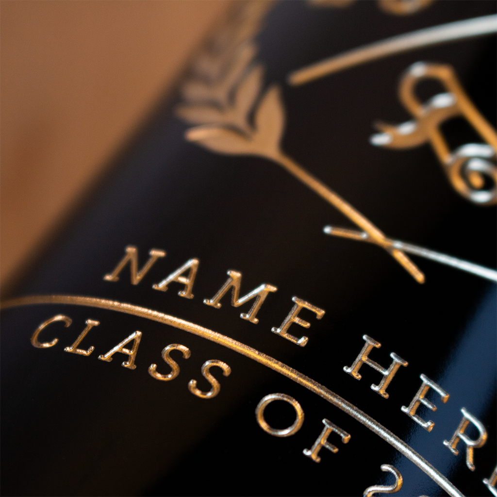 Deep etched and hand painted custom name and graduation year on Mano's Wine bottle